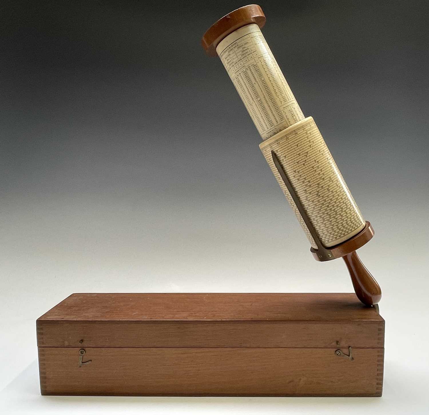 A Stanley Fuller cylindrical calculator, with mahogany and brass fittings, in original case with