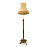 A brass Corinthian column standard lamp, late Victorian, raised on a stepped square base, overall