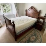 A 19th century French rosewood bed, the quarter veneered head and footboard with carved and turned