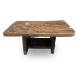 A rustic low table, made from reclaimed marine timber, raised on slab supports, height 43cm, width