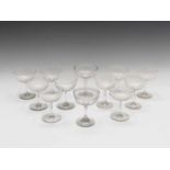 A set of six Edwardian champagne coupes, the bowls with acid etched geometric decoration, a
