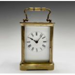A French brass cased carriage timepiece, with white enamel dial, height 15cm.