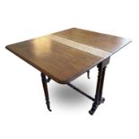 A Victorian mahogany Sutherland table, raised on turned legs and supports, height 70cm, width 105cm,