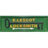 A Locksmith's sign, mid 20th century, for E.Lescot, mounted with an oversize steel key, height 45cm,