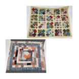 Patchwork quilts.One quilt with predominantly square and rectangular patches in multi coloured 1950s