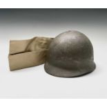 A Belgian paratrooper helmet, the liner stamped ABL and dated 1952 and a US khaki side hat, dated