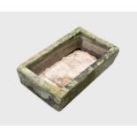 A carved stone trough planter of rectangular form. Height 17cm, width 69cm, depth 40cm.