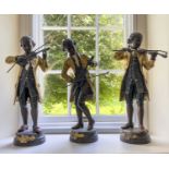 A group of three bronze figures of Mozart, after L. Gregoiroy, mid to late 20th century, each