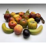 A collection of assorted wax fruit, including apples, bananas, lemons and pears, together with an