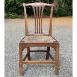 A country made elm side chair, early 19th century, with pierced splat and drop-in rush seat,