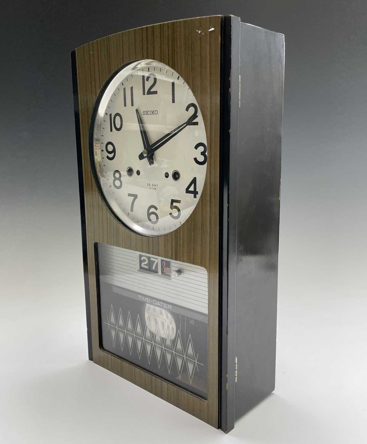 A Seiko Time-Dater thirty-day wall clock, 1960s, with digital day/date and woodgrain finish height - Image 4 of 7