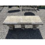 A classical design garden bench raised on three supports. Height 41.5cm, width 118cm, depth 41cm.