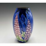 A Carlton Ware Handcraft 'New Delphinium' pattern baluster vase, having printed backstamp and