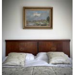 A mahogany and inlaid double bed head, probably French circa 1900, with oval basket of flower panel,