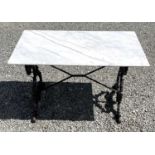 A black painted cast iron garden table with rectangular marble top. Height 69.5cm, width 109cm,