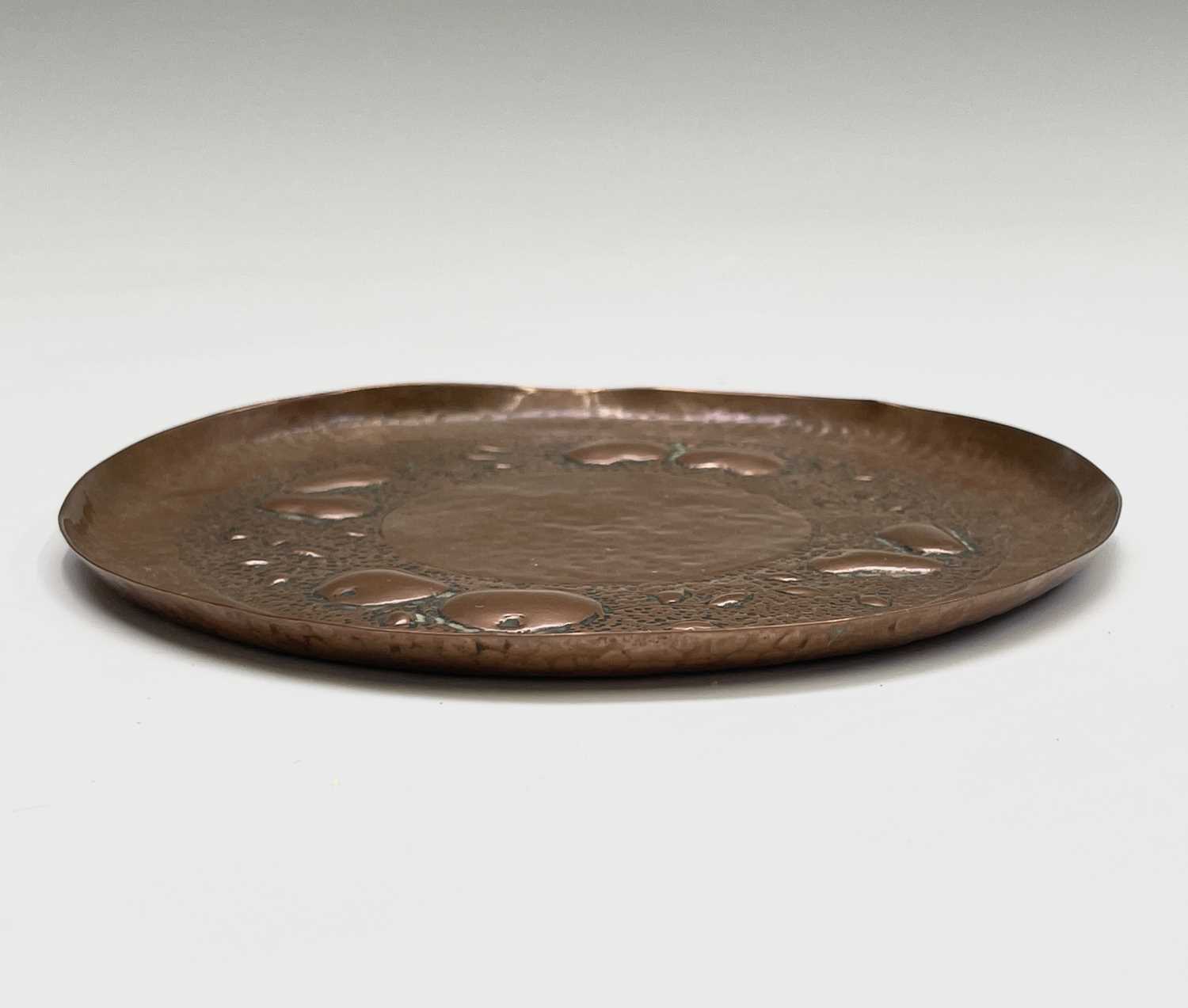 A Newlyn copper small circular dish, repousse decorated with apples and pears on a planished ground, - Image 4 of 6