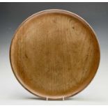 A Robin Nance turned circular sycamore tray, with raised edge, diameter 40.5cm.
