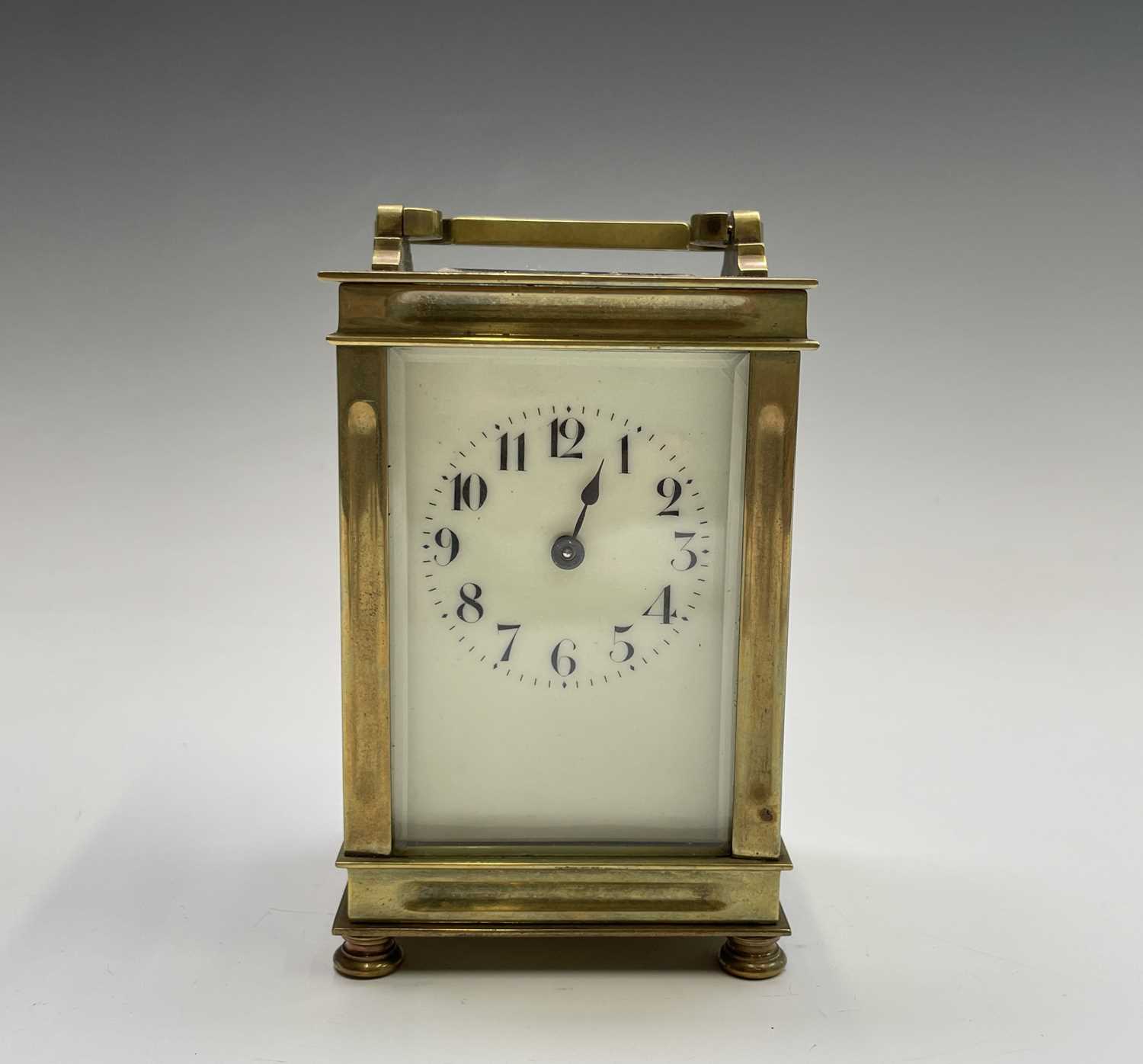 A French brass cased carriage clock, early 20th century, on turned feet, height 12.5cm.