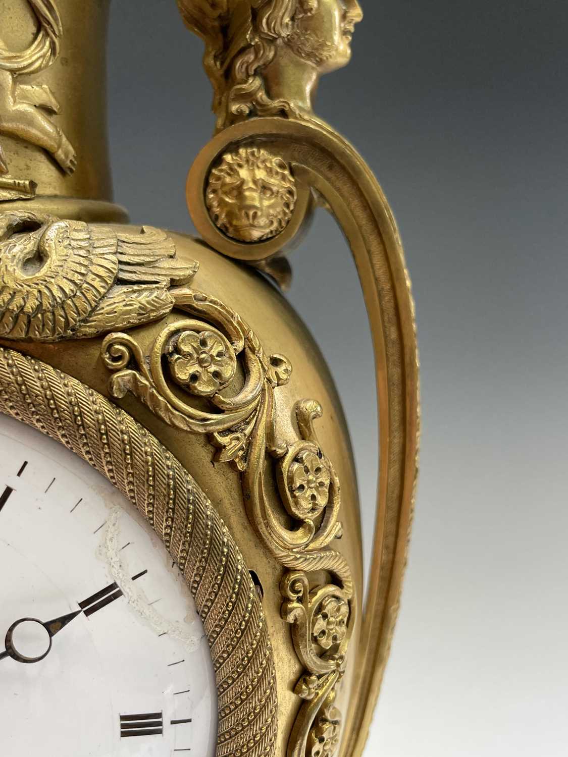 A French Empire ormolu cased mantel clock, of urn form, the covered rim applied with two winged - Image 5 of 12