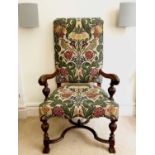 A 17th century style walnut open armchair, late 19th century with upholstered back and seat and