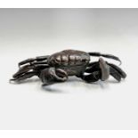 A Japanese bronze model of a crab, Meiji period, with articulated legs and pincers, one leg missing,