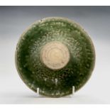 A Chinese celadon bowl, Ming Dynasty, the interior with central plain roundel surrounded by a part