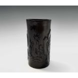 A Chinese bamboo brush pot, 18th/19th century, carved with a man fishing and sat on the riverbank,