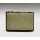 A Chinese carved jade panel, Qing Dynasty, decorated with a river scene and gilt metal mounted, 8.