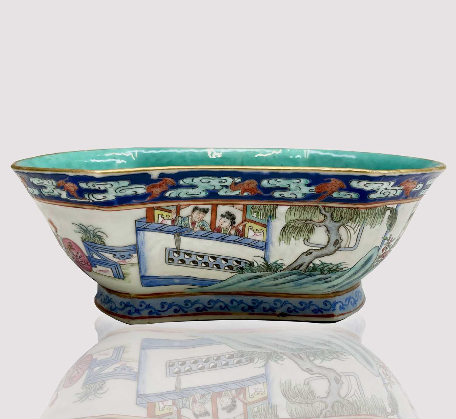 A Chinese famille rose porcelain bowl, 19th century, decorated with warriors in procession and
