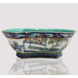 A Chinese famille rose porcelain bowl, 19th century, decorated with warriors in procession and