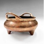 A Chinese bronze tripod censer, Xuande six character seal mark, height 8.5cm, diameter 14.5cm.