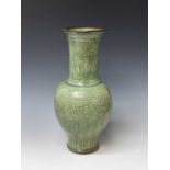 A large Chinese longquan celadon vase, possibly Yuan Dynasty, decorated with scrolling leafy