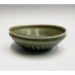 A Chinese celadon bowl, Ming Dynasty, the interior with an unglazed central roundel, diameter