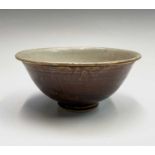 A Chinese celadon bowl, Ming Dynasty, the interior with a central roudel surrounded by a pale