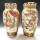 A pair of Japanese Satsuma pottery vases, Meiji Period, height 31cm.Condition report: Hairlines on