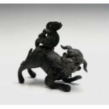 A Chinese bronze model of a dog of fo, 19th century, height 9cm, length 9.5cm.