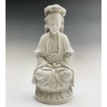 A large Chinese blanc de chine figure of a seated Guanyin, 19th century, height 36cm, width 17cm,