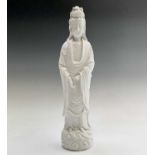 A large Chinese blanc de chine figure of a standing Guanyin, 18th/19th century, height 43.5cm, width
