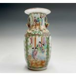A Chinese Canton porcelain vase, 19th century, with gilt handles, the panels painted with figures in