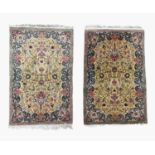 A pair of Tabriz rugs, North West Persia, mid 20th century, the saffron field with flowering leafy