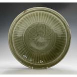 A large Chinese longquan celadon bowl, possibly Ming Dynasty, the centre decorated with a stylised