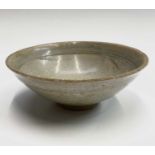 A Chinese celadon bowl, Ming Dynasty, diameter 16cm, height 6.5cm. Provenance:The Chris Davis