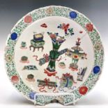 A Chinese famille verte 'Hundred Antiques' porcelain dish, Kangxi period, blue seal mark, diameter
