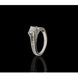 A pretty 18ct white gold diamond set ring, the principle stone a princess cut of 0.51ct, clarity