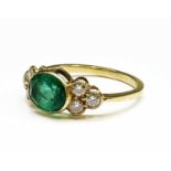 An emerald and diamond ring, the oval emerald weighs approximately 0.95cts (measuring 8.1x5.98x3.