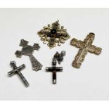 A 9ct gold cross 8.5gm and three silver crosses