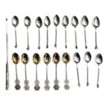A set of 12 African native silver coffee spoons with figure finials 59.7gm, six Chinese silver