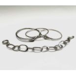 Three silver bangles and a silver chain bracelet 64gm