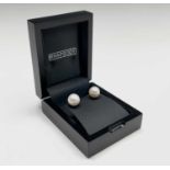 Pair of stunning Edison 11.45mm and 11.80mm pearl studs set in platinum.