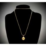 A 12.32mm golden South Sea pearl with 18ct gold mount on a silver gilt chain.Condition report: